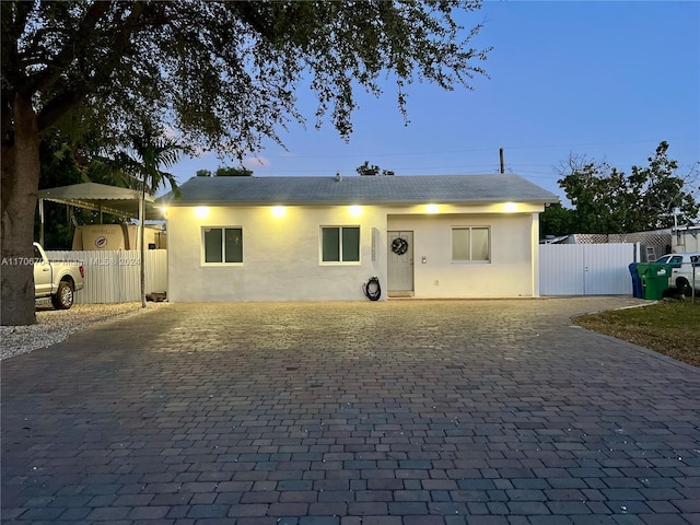 view of front of home featuring a carport