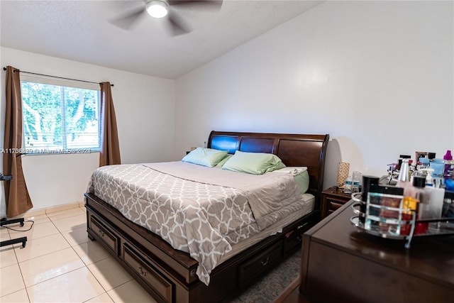 tiled bedroom with ceiling fan