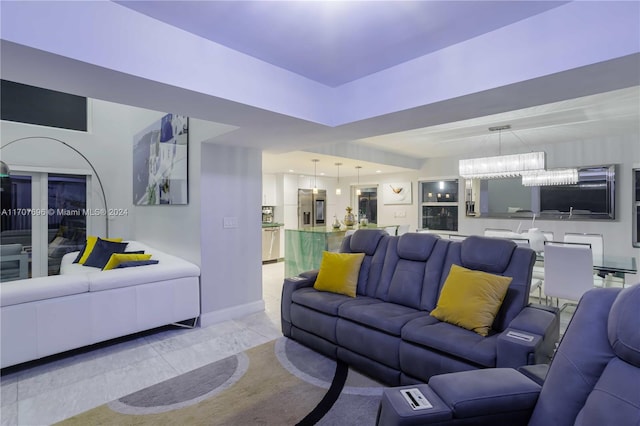 living room featuring a chandelier