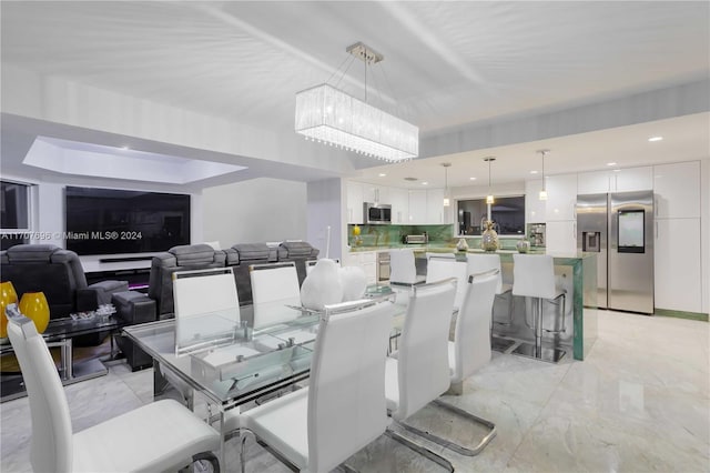 dining area with a notable chandelier