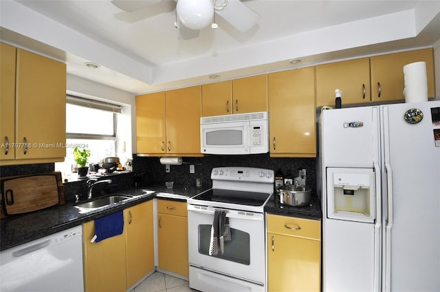 kitchen with ceiling fan, sink, tasteful backsplash, white appliances, and light tile patterned floors