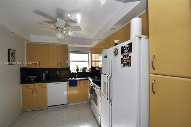 kitchen with white appliances, sink, decorative backsplash, ceiling fan, and light tile patterned floors