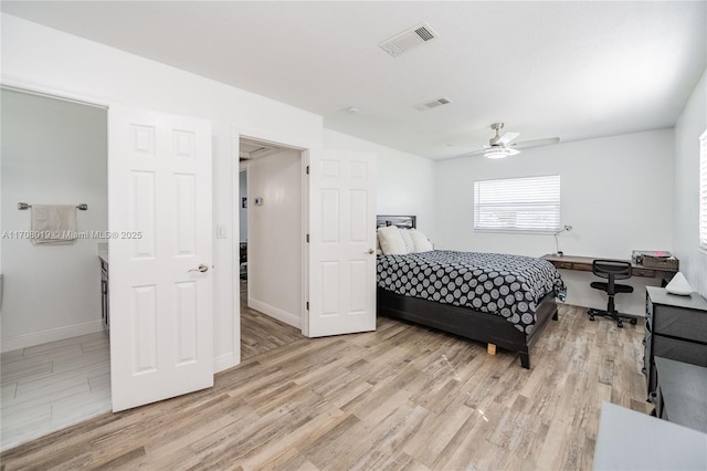 bedroom with light hardwood / wood-style flooring and ceiling fan