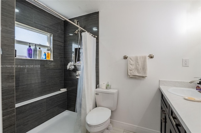 bathroom featuring a shower with curtain, vanity, and toilet