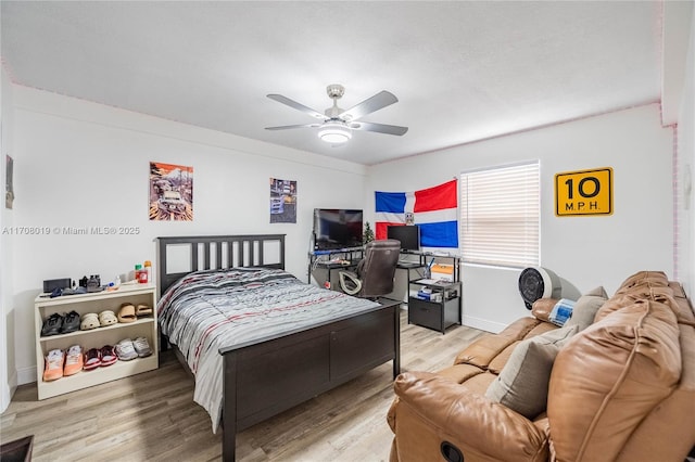 bedroom featuring ceiling fan and light wood-type flooring