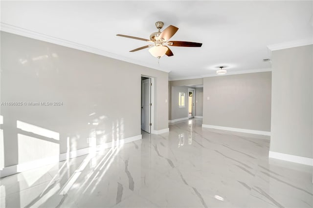 empty room with ceiling fan and crown molding