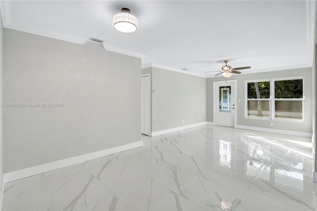 unfurnished room with ceiling fan and ornamental molding