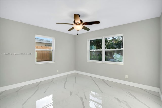 unfurnished room featuring ceiling fan