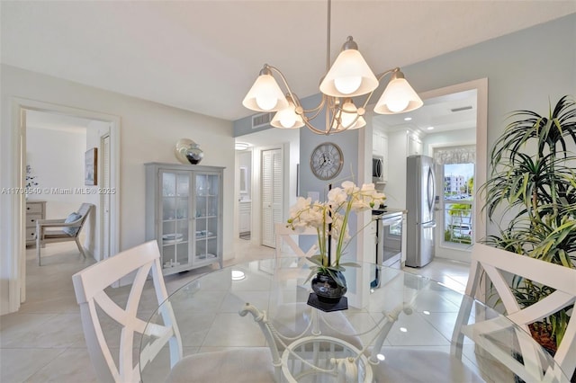 dining space featuring visible vents and light tile patterned flooring