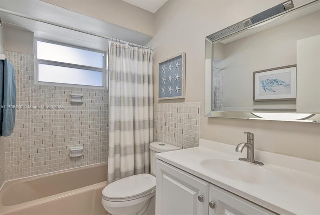 full bathroom featuring toilet, shower / tub combo, and vanity