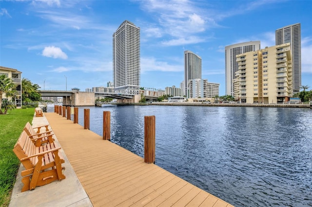 dock area with a water view and a city view