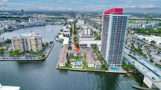 drone / aerial view featuring a water view and a city view