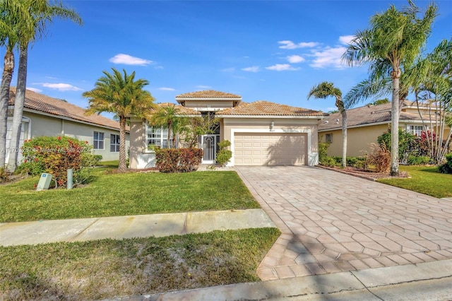 view of front of property with a front lawn and a garage