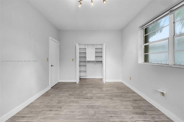 unfurnished room with light hardwood / wood-style floors