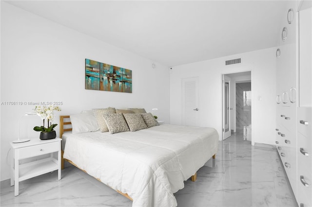 bedroom featuring marble finish floor and visible vents