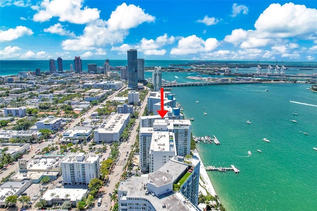 bird's eye view featuring a view of city and a water view