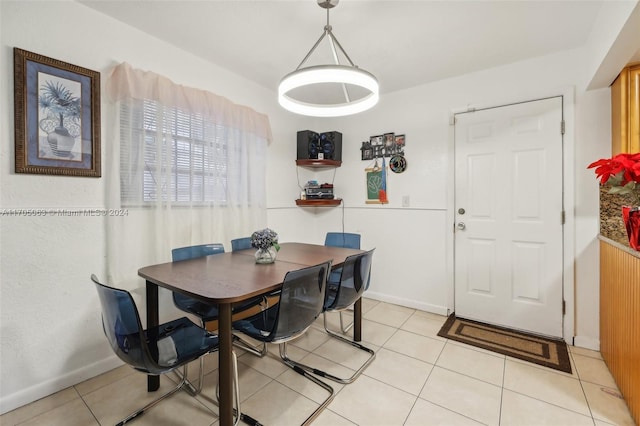 dining area featuring light tile patterned floors