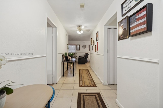 corridor featuring light tile patterned flooring