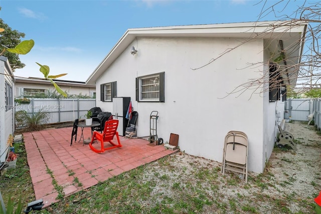 back of property with a patio area