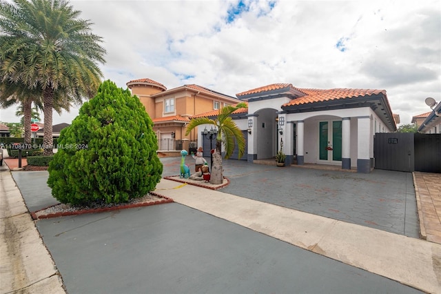 mediterranean / spanish house featuring french doors