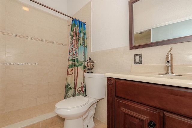 bathroom with vanity, a shower with curtain, tile patterned flooring, toilet, and tile walls