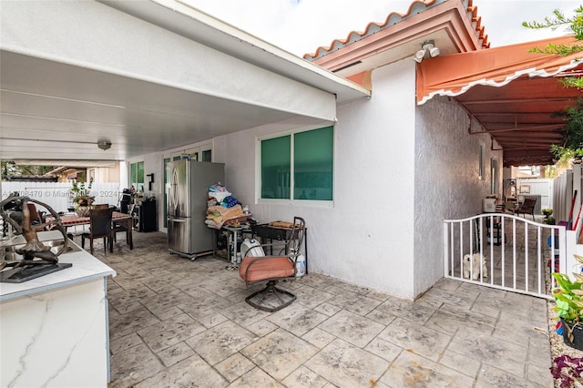 15226 SW 21st Ln, Miami, FL 33185 - view of patio featuring a sink and outdoor dining area