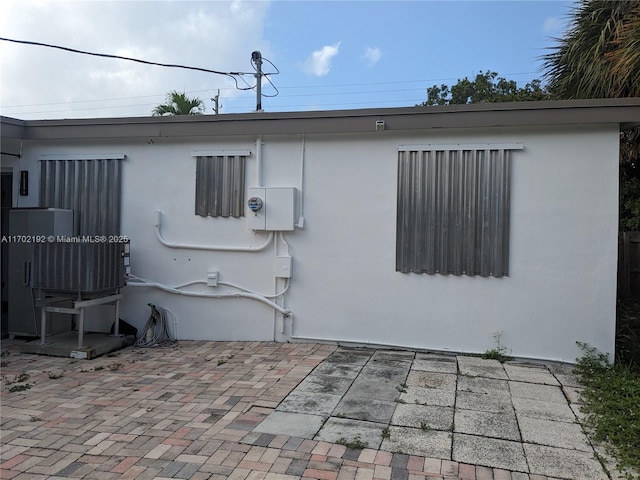 view of home's exterior with a patio area and stucco siding