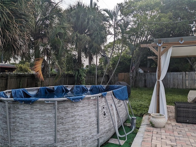 view of swimming pool featuring a fenced backyard and a fenced in pool
