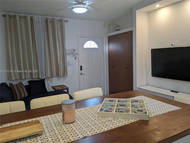living room featuring wood finished floors and ceiling fan