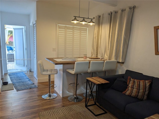 dining space with dark hardwood / wood-style flooring