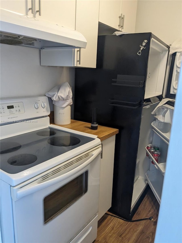 kitchen with wooden counters, under cabinet range hood, white cabinetry, white range with electric cooktop, and dark wood-style flooring