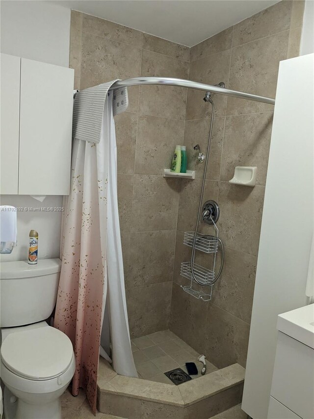 1916 NE 54th St, Pompano Beach, FL 33064 - bathroom featuring a shower stall, toilet, and vanity