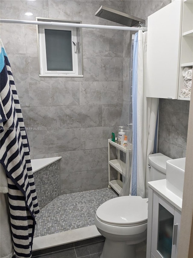1916 NE 54th St, Pompano Beach, FL 33064 - full bathroom featuring toilet, a tile shower, vanity, and tile patterned floors