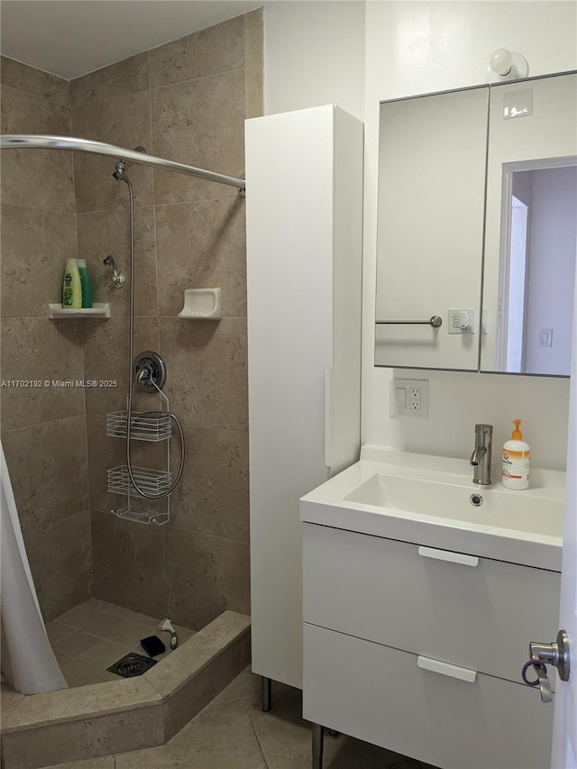 bathroom with vanity, tile patterned floors, and a stall shower