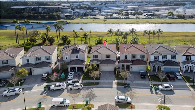 aerial view featuring a water view and a residential view