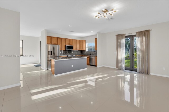 hallway featuring light tile patterned floors