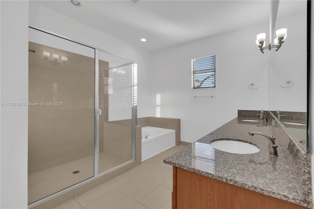 full bath featuring a stall shower, a garden tub, a sink, and double vanity