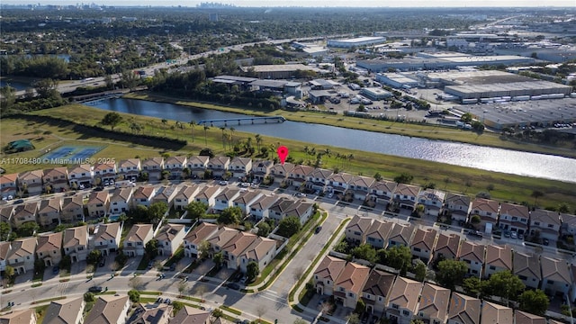 bird's eye view featuring a water view and a residential view