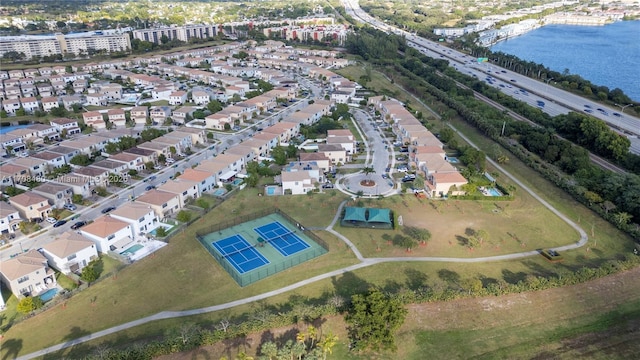 birds eye view of property with a water view and a residential view