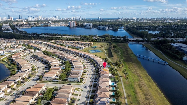 drone / aerial view with a view of city and a water view