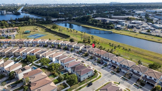 drone / aerial view with a residential view and a water view