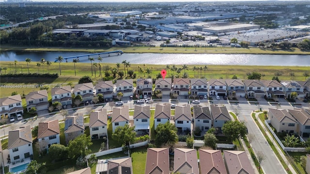 bird's eye view with a residential view and a water view