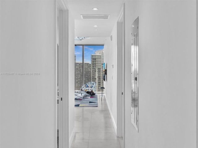 hallway with light tile patterned floors