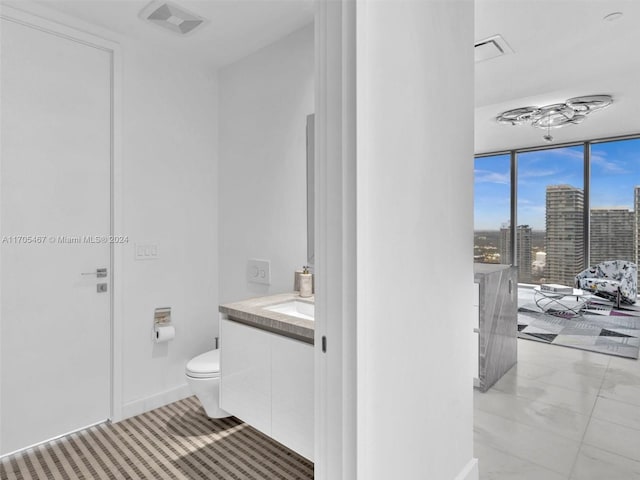 bathroom with vanity and toilet