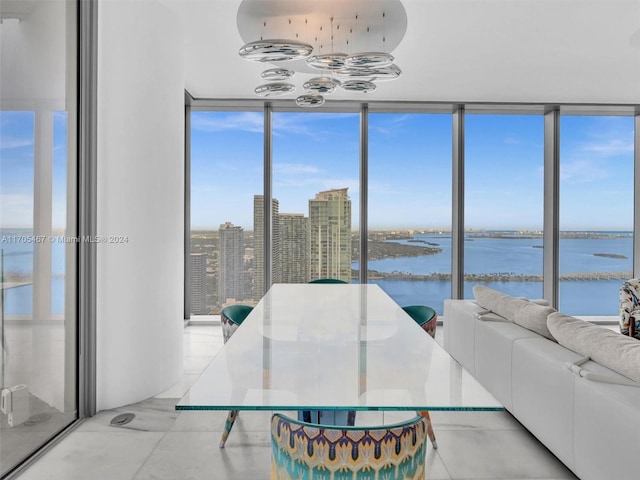 sunroom with a water view and a wealth of natural light