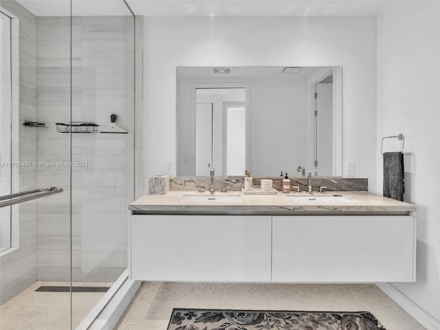 bathroom with vanity and an enclosed shower