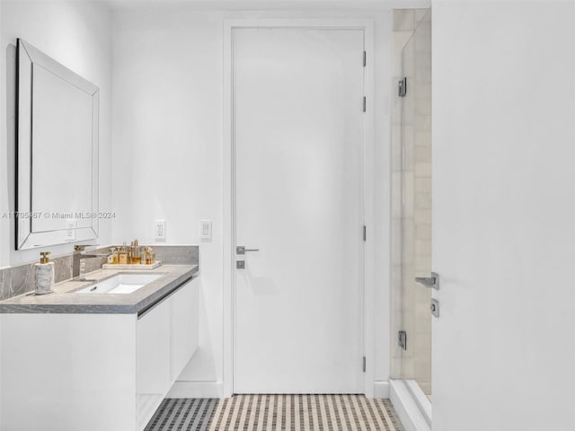 bathroom with vanity and an enclosed shower