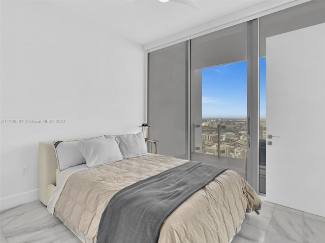 bedroom with floor to ceiling windows and ceiling fan