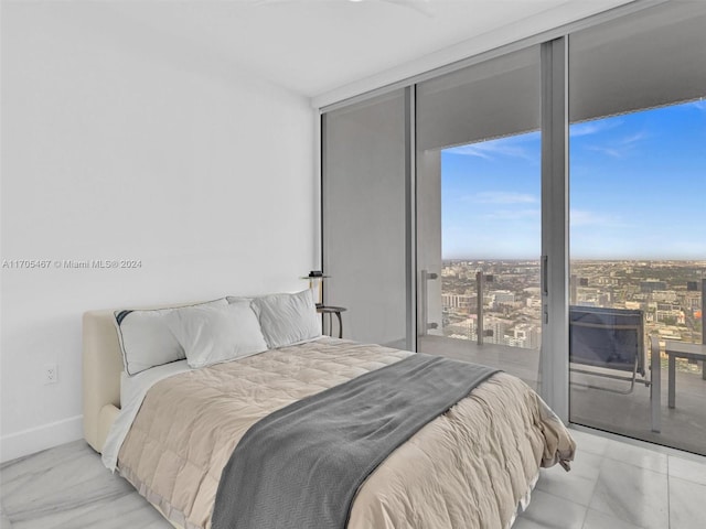 bedroom with a closet and expansive windows