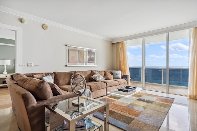 tiled living room featuring floor to ceiling windows, a water view, and crown molding